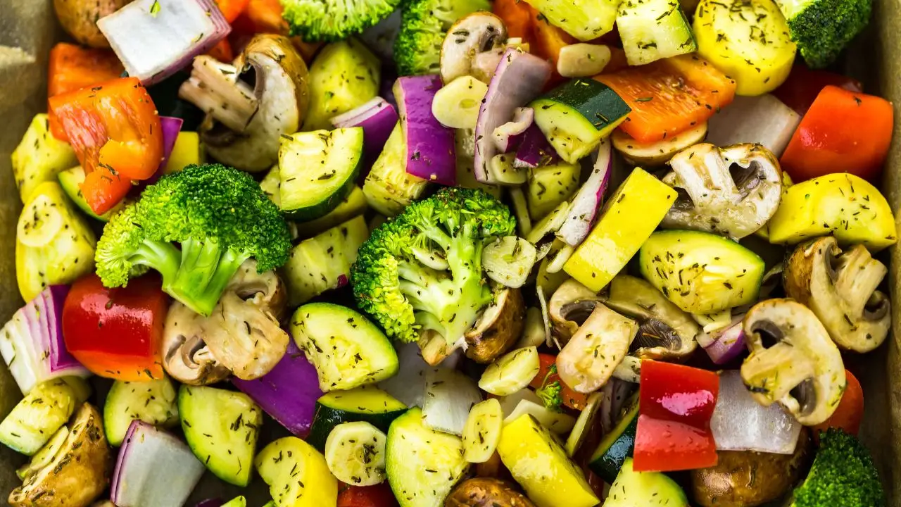 Colorful mix of winter vegetables including broccoli, zucchini, bell peppers, mushrooms, and onions, ideal for roasting and seasonal dishes.