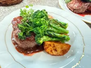 Beautifully Seared steak served with baby broccoli and potatoes