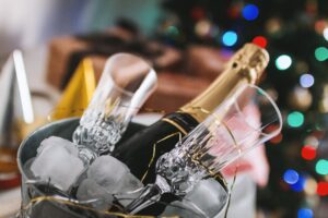 Top Picks: Fun ideas for Christmas Parties to Wow Guests 1 Bucket of champagne with flutes Christmas Parties to Wow Guests